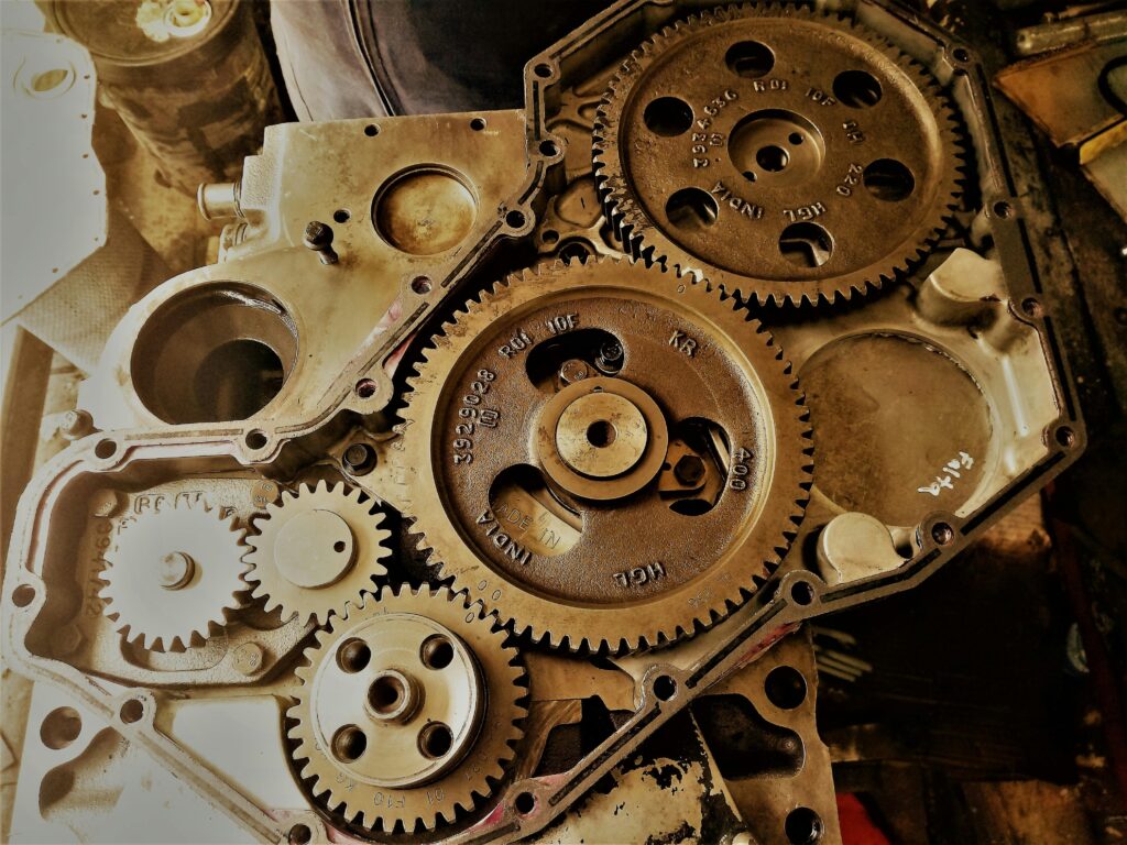 Detailed view of interconnected gears showcasing engineering precision and technology in a workshop.